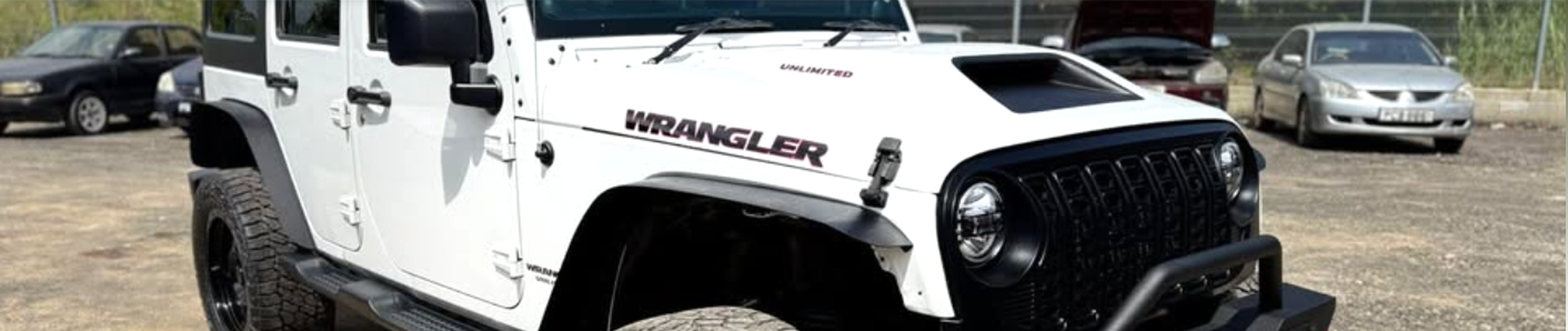 White Jeep Wrangler featured by Toiz Wit Noiz Auto Sales